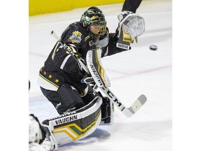 London Knights goalie Jordan Kooy makes a save during the team's game against the Windsor Spitfires in London on Friday.(Derek Ruttan/The London Free Press)