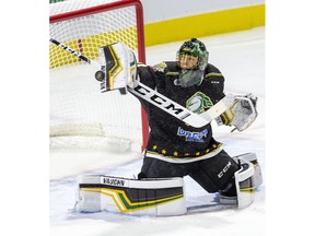 London Knights goalie Jordan Kooy makes a save during the team's game against the Windsor Spitfires  in London on Friday. (Derek Ruttan/The London Free Press)