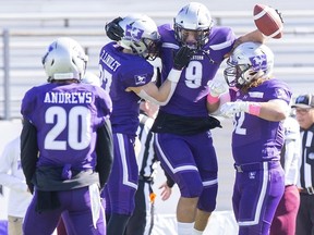 Western Mustang Myles Manalo celebrates an  interception against the Ottawa Gee Gees in London on Saturday Oct. 19, 2019. Manalo has been invited to the Canadian Football League's national combine for 2021 draft prospects. (Derek Ruttan/The London Free Press)
