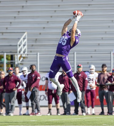Western Mustang Malik Besseghieur  makes a leaping reception during their game against the Ottawa Gee Gees in London, Ont. on Saturday October 19, 2019. Derek Ruttan/The London Free Press/Postmedia Network