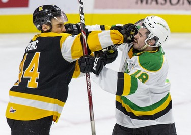 London Knight Liam Foudy exchanges blows with Kingston Frontenac Lucas Peric during the second period of their game in London, Ont. on Saturday October 19, 2019. Derek Ruttan/The London Free Press/Postmedia Network