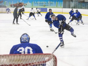 London Nationals Zach Sheedy fires a puck at netminder Devyn Clark at the Western Fair Sports Centre Tuesday as the Greater Ontario Junior Hockey League Western Conference-leading Nats gear up to host the retooling Komoka Kings Wednesday night. (Derek Ruttan/The London Free Press)