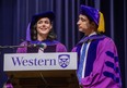 Tessa Virtue and Scott Moir gave the convocation address at Western University graduation ceremony in London, Ont. on Wednesday. The two time Olympic champion and three time world champion ice dancers received honorary doctorates from the school.  (Derek Ruttan/The London Free Press)