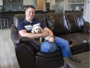 Matt Reid, former chair of the Thames Valley District School Board at home with his dog, Latte. Reid has been nominated for a Pillar Non-Profit award for his work with LGBTQ youth. Photo shot in London, Ont. on Friday October 25, 2019. (Derek Ruttan/The London Free Press)