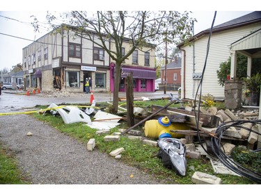 The debris field is extensive after a car  tore a hole in the Society Cafe at the corner of Blackfriars Street and Wilson Avenue before slamming into the house at 45 Blackfriars St. in London, Ont. on Sunday Oct. 27, 2019. (Derek Ruttan/The London Free Press)