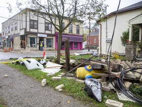 The debris field is extensive after a car  tore a hole in the Society Cafe at the corner of Blackfriars Street and Wilson Avenue before slamming into the house at 45 Blackfriars St. in London, Ont. on Sunday Oct. 27, 2019. (Derek Ruttan/The London Free Press)