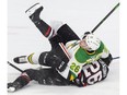 Josh Nelson of the London Knights falls on top of Philip Tomasino of the Niagara Ice Dogs during the first period of their OHL hockey game at Budweiser Gardens on Sunday Oct. 27, 2019. Derek Ruttan/The London Free Press
