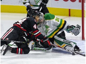 Niagara Ice Dog Akil Thomas fails to stuff the puck past London Knights goalie Brett Brochu  during the second period of their OHL hockey game at Budweiser Gardens on Sunday Oct. 27, 2019. Derek Ruttan/The London Free Press