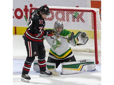 The puck bounces backward after striking the stick of Niagara Ice Dog forward Kyen Sopa, who was attempting to tip it past London Knights goalie Brett Brochu, during the second period of their OHL hockey game at Budweiser Gardens on Sunday Oct. 27, 2019. Derek Ruttan/The London Free Press