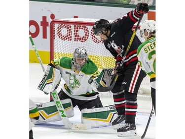 Niagara Ice Dog forward Kyen Sopa tips a shot into the upper body of London Knights goalie Brett Brochu  during the second period of their OHL hockey game at Budweiser Gardens on Sunday Oct. 27, 2019. Derek Ruttan/The London Free Press