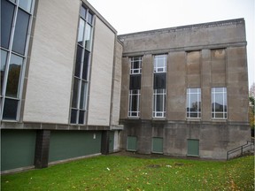 Ground floor windows on the former London Public Library on Queens Street have been boarded up in London, Ont. on Thursday October 31, 2019. (Derek Ruttan/The London Free Press)