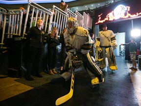 Jordan Kooy of the Knights prepares to lead the team onto the ice for their first game of the season against the Windsor Spitfires at Budweiser Gardens in London.  Photograph taken on Friday September 21, 2018.  (Mike Hensen/The London Free Press)