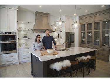 Designer Jillian Summers and David Reis, president of Reis Design + Build, share honours at 54 Edwin Dr. in London, one of the Dream Lottery prizes. (Derek Ruttan/The London Free Press)