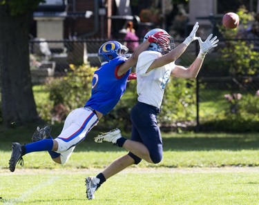 Lucas Viking Will Adam almost catches a pass while covered by Mony Madlol of the Oakridge Oaks during their football game at Lucas in London, Ont. on Thursday Oct. 10, 2019. The home team won the game 48-6. Derek Ruttan/The London Free Press