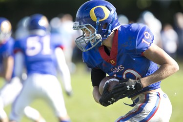 Oakridge Oaks ball carrier Chris Caruso runs during their football game against the Lucas Vikings at Lucas in London, Ont. on Thursday Oct. 10, 2019. The home team won the game 48-6. Derek Ruttan/The London Free Press