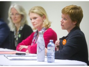 London West NDP candidate Shawna Lewkowitz speaks at a London West candidates' meeting Thursday night at the London Mosque. With Lewkowitz is Mary Ann Hodge of the Green Party and Kate Young of the Liberals. (Mike Hensen/The London Free Press)