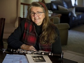 Maxine Patzer, who plays clarinet in Encore: The Concert Band, shows off a war time photo of her father, Maxwell Fonger Doan, and some letters he wrote home during his time in England and Italy. For a time after the war, Major Doan, who was wounded in Italy, was commanding officer at the Dundas Street armouries in London. (Derek Ruttan, The London Free Press)
