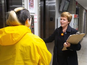 Shawna Lewkowitz, the NDP candidate for London West, talks with voter Alyssia Naraine as she campaigns on Wednesday October 16, 2019. Election night is this Monday. Mike Hensen/The London Free Press/Postmedia Network