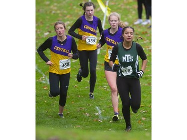 Suraya Byam of Mother Teresa leads the junior girls' TVRA cross-country final at Springbank Park on Thursday Oct. 17, 2019. Byam managed a strong second behind Central's Rebecca Christensen, No. 389. Mike Hensen/The London Free Press
