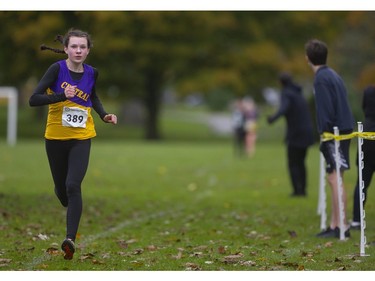 Central's Rebecca Christensen pulls ahead of a small pack of her teammates and Suraya Byam of Mother Teresa to win the junior girls' TVRA cross-country final at Springbank Park on Thursday Oct. 17, 2019. Mike Hensen/The London Free Press