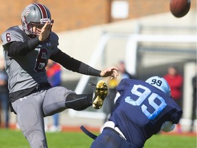 South Lions kicker Oliver Griffiths was under pressure all day from the hard charging Matt Bain of Lucas but was able to get his punts off during a battle of the undefeated TVRA Central teams at South on Friday October 18, 2019.  (Mike Hensen/The London Free Press)