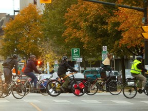 The #CriticalMass bike ride heads out of Victoria Park just before 6 p.m. Friday as they pedal for more cycling infrastructure in London. (Mike Hensen/The London Free Press)