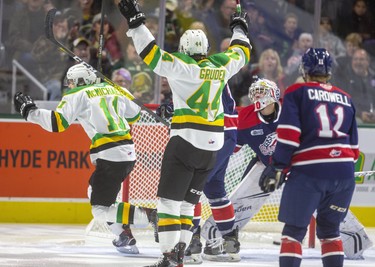 Connor McMichael and Jonathan Gruden of the Knights celebrate McMichael's goal in the first minute of the game as he got a writer past Tristan Lennox of the Saginaw Spirit during the first period of their game Friday night at Budweiser Gardens in London, Ont.  Photograph taken on Friday October 25, 2019.  Mike Hensen/The London Free Press/Postmedia Network