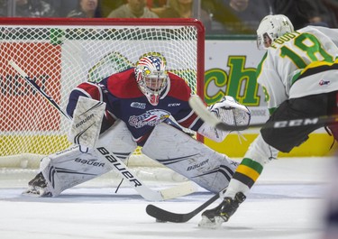 Liam Foudy of the Knights gets a quick shorthanded breakaway on Saginaw Spirit goaltender Tristan Lennox during the first period of their game Friday night at Budweiser Gardens in London, Ont.  Photograph taken on Friday October 25, 2019.  Mike Hensen/The London Free Press/Postmedia Network