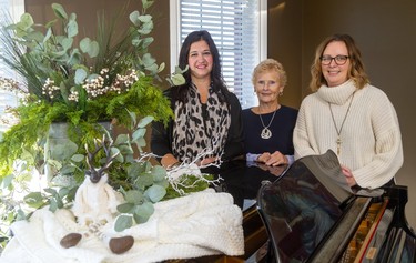 Christmas home tour for the Rotary Club Tour of Homes east of St. Thomas, at the home of Jim & Carol Wiebe. From left, decorator Jaclyn McClenaghan of Berry Hill, Patricia Martyn of there Rotary Club Tour of Homes, and home owner Carroll Wiebe. Mike Hensen/The London Free Press/Postmedia Network