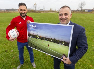 Dave DeBenedictis, general manager of London TFC, and Adam Carapella, vice-president of operations for Tricar Group, show off the new site behind the developer's head office on Colonel Talbot Road that will be the new site of TRICAR Field, and the home of the London TFC Academy. (Mike Hensen/The London Free Press)