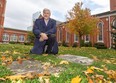 London historian Joseph O'Neil shows where the old cemetery at St. Paul's cathedral still has some markers, and O'Neil says bodies are still buried on the site in London, Ont.   (Mike Hensen/The London Free Press)