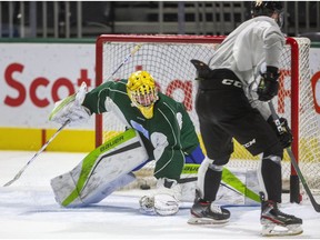 New London Knights goaltender Dylan Myskiw tries to get over to cover the post as forward Matvey Guskov crosses in front of the net during Myskiw's first day of practice at Budweiser Gardens on Tuesday Oct. 29, 2019.  Mike Hensen/The London Free Press