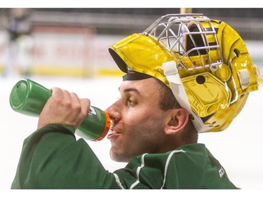 New London Knights goaltender Dylan Myskiw grabs a quick drink at his first practice at Budweiser Gardens in London, Ont.  Photograph taken on Tuesday October 29, 2019.  Mike Hensen/The London Free Press/Postmedia Network