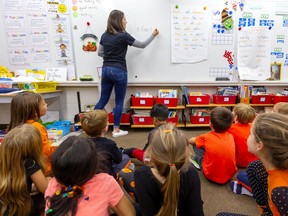 Tessa Bowser of St. George Catholic elementary school teaches French to grade 1-2 students Thursday. The London District Catholic school board has announced it is stopping French education for grades 1-3 starting in fall of 2020. (Mike Hensen/The London Free Press)