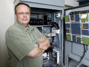 City Hall Manager Shane Maguire  poses with a traffic signal control cabinet at London City Hall in this file photo.