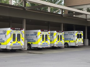 Four ambulances are parked next to the ambulance and police entrance to the Victoria Hospital Emergency Department. (File photo)