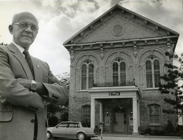 Roger Verbuyst, Aylmer mayor stands in front of opera house and town hall, 1987. (London Free Press files)