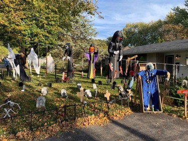 This house on Queen Anne Circle has been doing a front yard display for years. There are animated props throughout the yard that are self-activated as you walk through. At night, there are smoke machines, strobe lights, movie projections on the windows, and the garage is a full projection screen. 
(Photo by Brigham Whitehead)