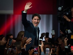 Prime minister Justin Trudeau celebrates his victory with his supporters at the Palais des Congres in Montreal during Team Justin Trudeau 2019 election night event in Montreal, Canada on October 21, 2019. - Prime Minister Justin Trudeau's Liberal Party held onto power in a nail-biter of a Canadian general election on Monday, but as a weakened minority government. (Photo by Sebastien ST-JEAN / AFP)