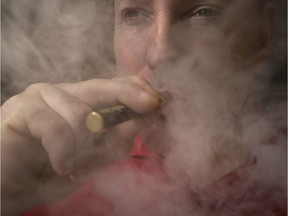 Cannabis for vaping is the next big retail marketplace push for Leamington's Aphria Inc, which has begun production of vaping products ahead of Health Canada approval. Here, a Windsor man enjoys his vaporizer pen in downtown Windsor on Friday, Oct. 25, 2019.