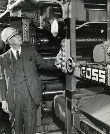Walter J. Blackburn, president and managing director of The London Free Press Printing Company Limted, presses the button to start the first official paper of the new Goss presses in the new Free Press building, 1965. (London Free Press files)