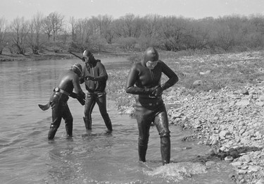 Police divers emerge from the Thames River near Thorndale on April 15, 1968, searching for clues not far from where the body of nine-year-old Frankie Jensen, who'd gone missing from his London home Feb. 9, was found by canoeists three days earlier. (London Free Press Collection of Photographic Negatives (1968-04-15), Archives and Special Collection, Western Libraries, Western University)