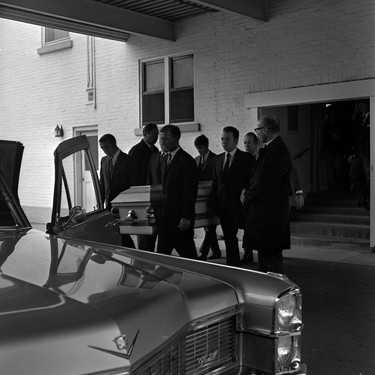 Pallbearers carry Jackie English to the hearse for the ride to Mount Pleasant Cemetery. (London Free Press Collection of Photographic Negatives (1968-04-15), Archives and Special Collection, Western Libraries, Western University)