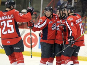 Windsor Spitfires Kyle McDonald, Daniel D'Amico, Luke Boka and Connor Corcoran celebrate a goal during first-period Ontario Hockey League action. (BRIAN KELLY/THE SAULT STAR/POSTMEDIA NETWORK)