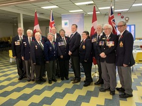 Jeff Yurek, centre, minister of environment, conservation and parks and MPP for Elgin-Middlesex-London, is surrounded by  veterans and their supporters Friday at the Lord Elgin branch of the Royal Canadian Legion in St. Thomas, as he announces free weekday admission to provincial parks for veterans living in Ontario and active members of thhe Canadian Armed Forces starting Monday. (Laura Broadley/Postmedia News