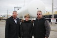 Dave Epp, left, MP for Chatham-Kent-Leamington, Karen Vecchio, MP for Elgin-Middlesex-London and Dave Karn, owner of Dowler Karn, stand in Dowler Karn’s rail terminal, which sits empty after 3,200 CN Rail workers walked off the job Tuesday causing a lack of propane supply. (Laura Broadley/Postmedia Network)