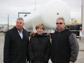 Dave Epp, left, MP for Chatham-Kent-Leamington, Karen Vecchio, MP for Elgin-Middlesex-London and Dave Karn, owner of Dowler Karn, stand in Dowler Karn’s rail terminal, which sits empty after 3,200 CN Rail workers walked off the job Tuesday causing a lack of propane supply. (Laura Broadley/Postmedia Network)