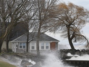 Waves crash onto a home along Point Pelee Drive in Leamington as high winds hit the area on Wednesday. Photo taken on Wednesday Nov. 27, 2019. (DAN JANISSE/THE WINDSOR STAR)