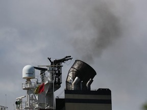 Smoke is seen pouring from the smoke stack on a container ship at Port Everglades  (Photo by Joe Raedle/Getty Images)