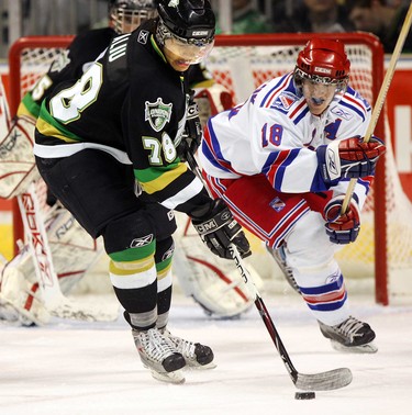 London Knight defenceman Akim Aliu clears his zone in front of Kitchener Ranger and Team Canada hero Matt Halischuk in the first period of their game at the John Labatt Centre in London, Ontario on Thursday, January10.n/a